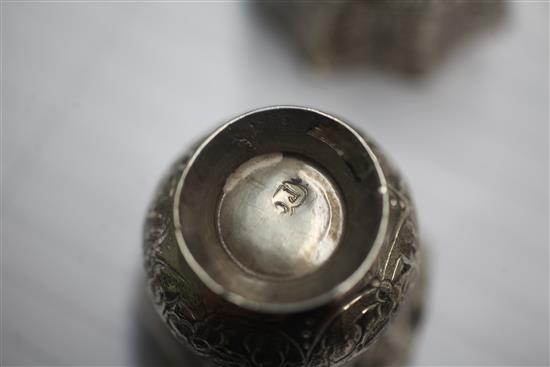 Four assorted late 18th century Russian silver vodka tots, largest 45mm.